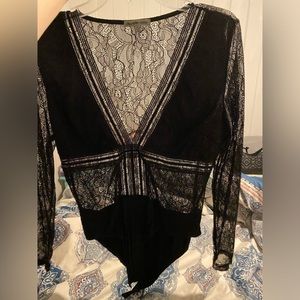 Black lace bodysuit from Charlotte Russe. Size large. Wore once 2 years ago.